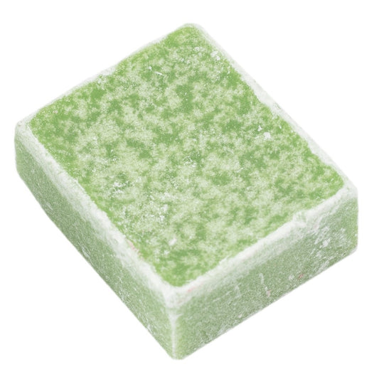 Grüner Duftblock mit weißen Partikeln